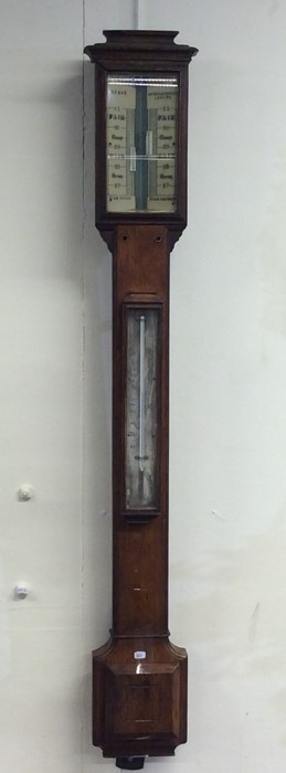 A good oak cased stick barometer. By EVE of London