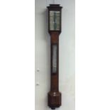 A good oak cased stick barometer. By EVE of London