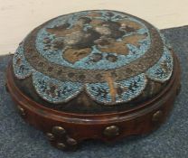 An attractive circular bead top stool with brass m