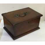 A Georgian mahogany tea caddy / writing box with b