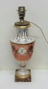 An attractive porcelain table lamp decorated with