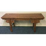 A Continental hardwood hall table. Est. £80 - £120