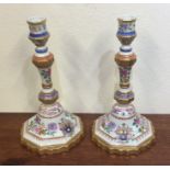 An attractive pair of crested decorative candlesti