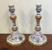 An attractive pair of crested decorative candlesti