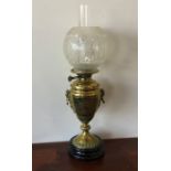 A tall brass oil lamp with etched shade. Est. £30