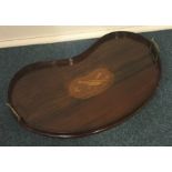 A Victorian mahogany kidney shaped tea tray with b