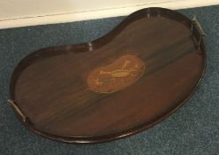 A Victorian mahogany kidney shaped tea tray with b
