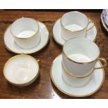 A Limoges gilt part coffee set. Est. £15 - £20.