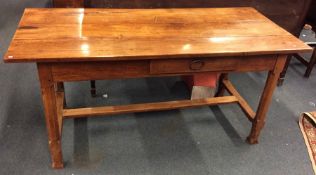 A good fruit wood dining table with plank top and