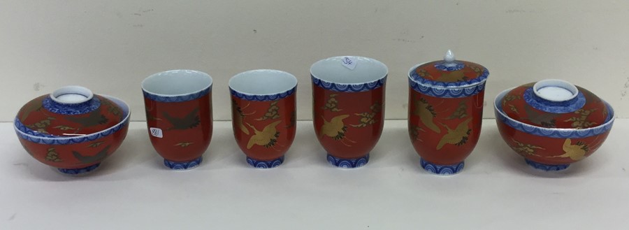 Nine pieces of decorative red, blue and gilt china
