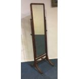 A mahogany dressing mirror on four sweeping suppor