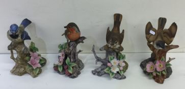 A group of four decorative bird ornaments. Est. £1