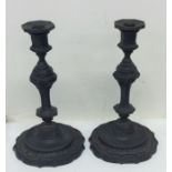 A good pair of bronze candlesticks, the shaped bas