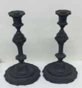 A good pair of bronze candlesticks, the shaped bas