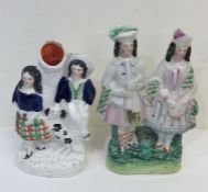 Two pairs of Staffordshire figures. Est. £20 - £30