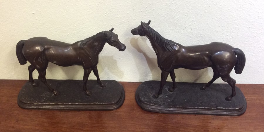 A pair of spelter figures in the form of race hors