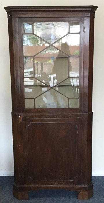 A Georgian mahogany two part corer cabinet. Est. £