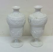 A pair of good white glazed vases decorated with f