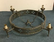 A large pewter light fitting. Est. £20 - £30.