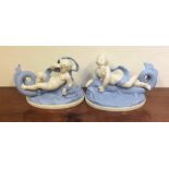 A pair of stylish blue and white figures of childr