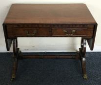 A reproduction two lap occasional table. Est. £20