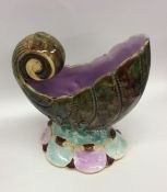 A malachite spoon warmer in the form of a shell to