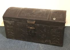 An unusual Antique leather domed top trunk decorat