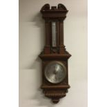 A good quality oak cased barometer. Retailed by Se