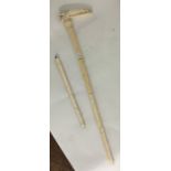 An unusual carved ivory walking stick of tapering