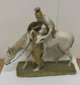 A large Royal Dux model of a horse and rider on re