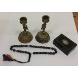 A pair of brass mounted candlesticks on marble bas