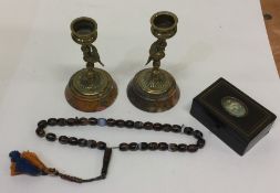 A pair of brass mounted candlesticks on marble bas
