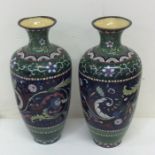 A pair of green enamelled cloisonne vases decorate