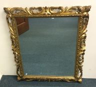 An attractive gilt mirror with scroll frame. Appro