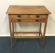 An Edwardian three drawer bedside chest with inlai