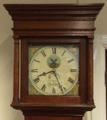 An oak cased eight day grandfather clock. By Jack