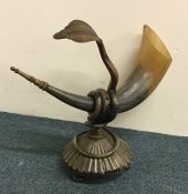 An unusual horn with a coiled figure of a constric