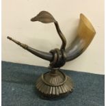 An unusual horn with a coiled figure of a constric
