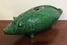 An unusual green pottery figure of an animal model