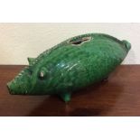 An unusual green pottery figure of an animal model