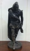 A large spelter figure of a Tudor gentleman on cir