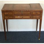 A Victorian sewing table with hinged top on taperi