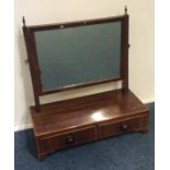 A Georgian mahogany two drawer toilet mirror. Est.