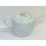 An 18th Century white glazed barrel shaped teapot