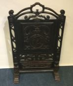 A large Continental fire screen decorated with tri