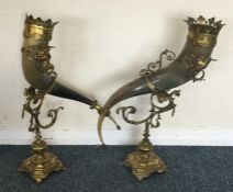 A pair of massive horn vases decorated on brass st