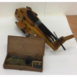 A carved wooden model of an RAF helicopter togethe