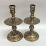 A pair of 17th Century brass candlesticks of typic