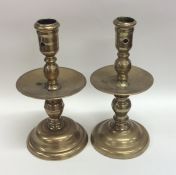 A pair of 17th Century brass candlesticks of typic