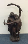 A tall bronze figure of a romantic couple. Marked